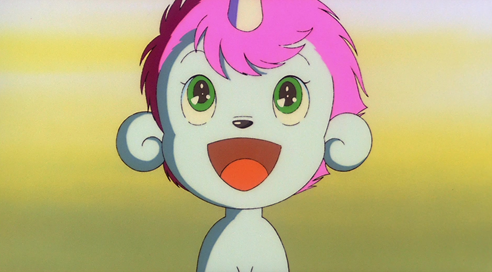 Unico, a small white creature that is a tiny unicorn baby, has a really big happy smile.