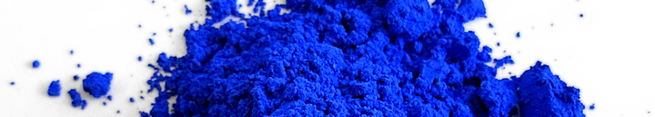A dark blue pigment, YInMn Blue. It is in powder form.
