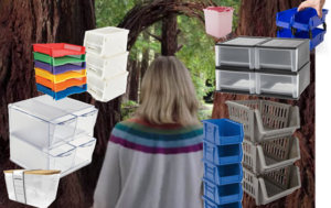 A woman surrounded by various stackable organizational containers. 